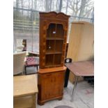 A YEW WOOD CORNER CUPBOARD WITH GLAZED UPPER PORTION