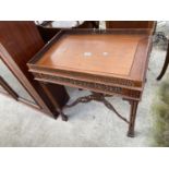 A REPRODUCTION CHIPPENDALE STYLE OCCASIONAL TABLE WITH GALLERIED TOP AND PIERCED FRETWORK CROSS