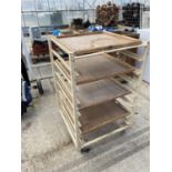 A FOUR WOODEN SHELVED POTTERS TROLLEY