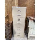 A FOUR DRAWER METAL COMMODORE FILING CABINET