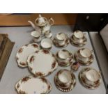 A ROYAL ALBERT 'OLD COUNTRY ROSES' SIX TRIO TEA SET TO INCLUDE A TEAPOT AND CAKE PLATES