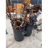 AN EXTREMELY LARGE QUANTITY OF WALKING STICKS, STICK SEATS AND GOLF CLUBS ETC