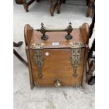 A VICTORIAN OAK PURDONIUM WITH BRASS HANDLE AND HINGES