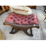 AN OXBLOOD LEATHER X FRAME STOOL WITH BUTTONED SEAT