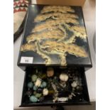 A BLACK LACQUERED BOX OF ASSORTED COSTUME JEWELLERY MAINLY NECKLACES