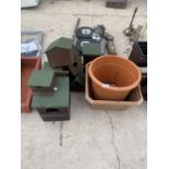 A QUANTITY OF BIRD HOUSES AND PLANTERS ETC