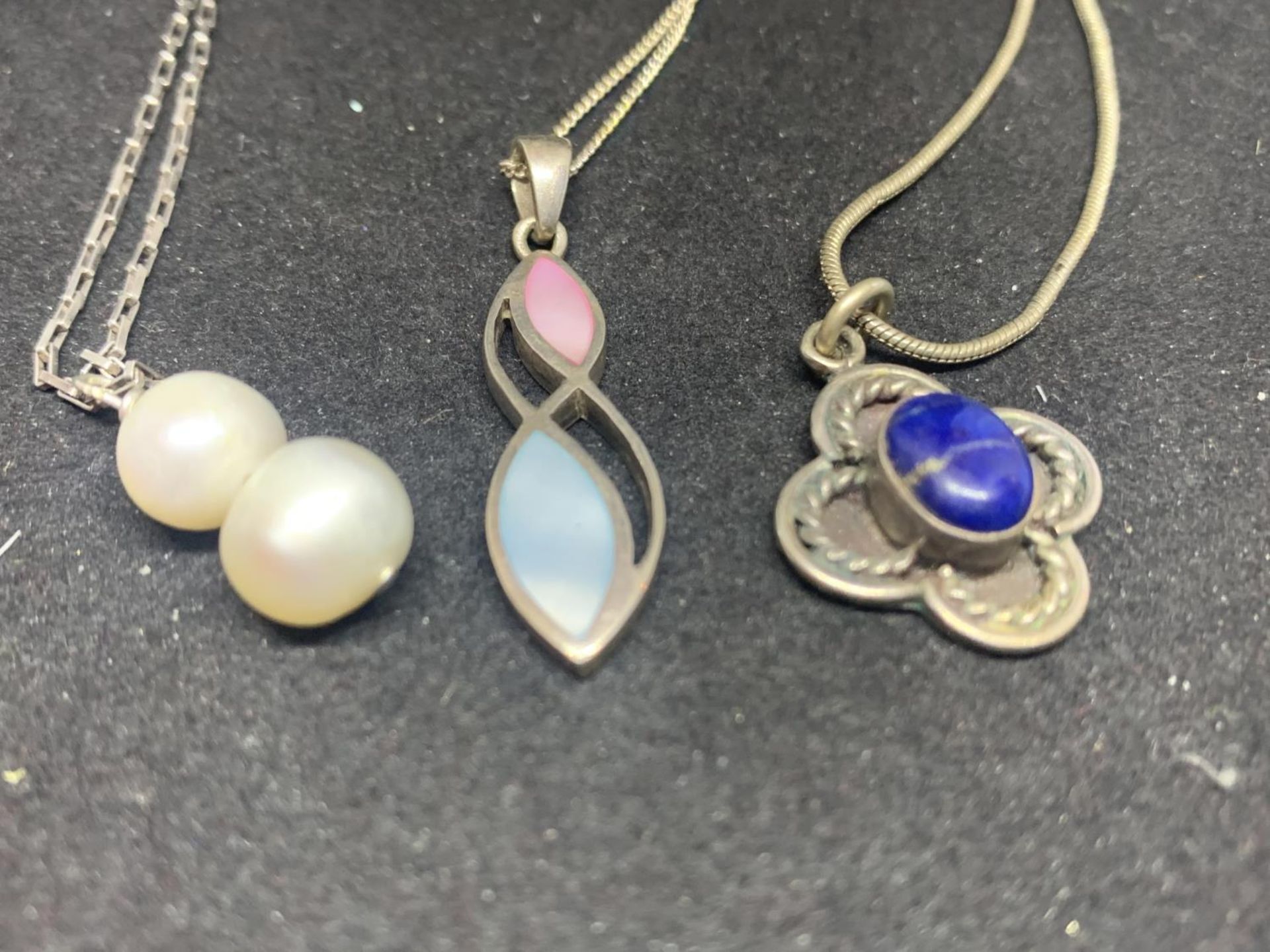 THREE SILVER NECKLACES WITH PENDANTS TO INCLUDE A BLUE STONE FLOWER DESIGN, PEARLS ETC - Image 2 of 2