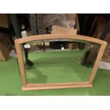 A WOODEN FRAMED CURVED TOP DRESSING TABLE MIRROR