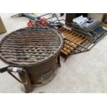 A CAST IRON FIRE GRATE AND A FURTHER GARDEN FIRE PIT
