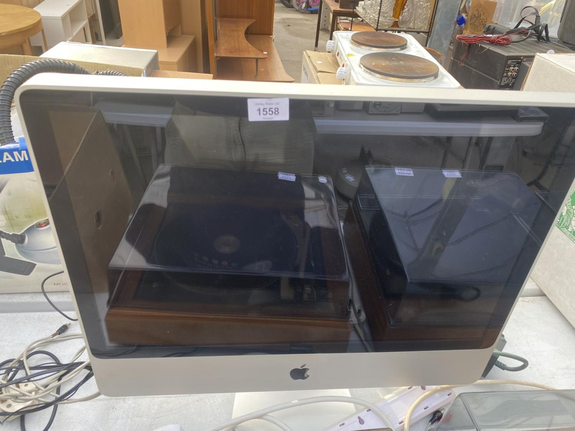 AN APPLE COMPUTER MONITOR BELIEVED IN WORKING ORDER BUT NO WARRANTY