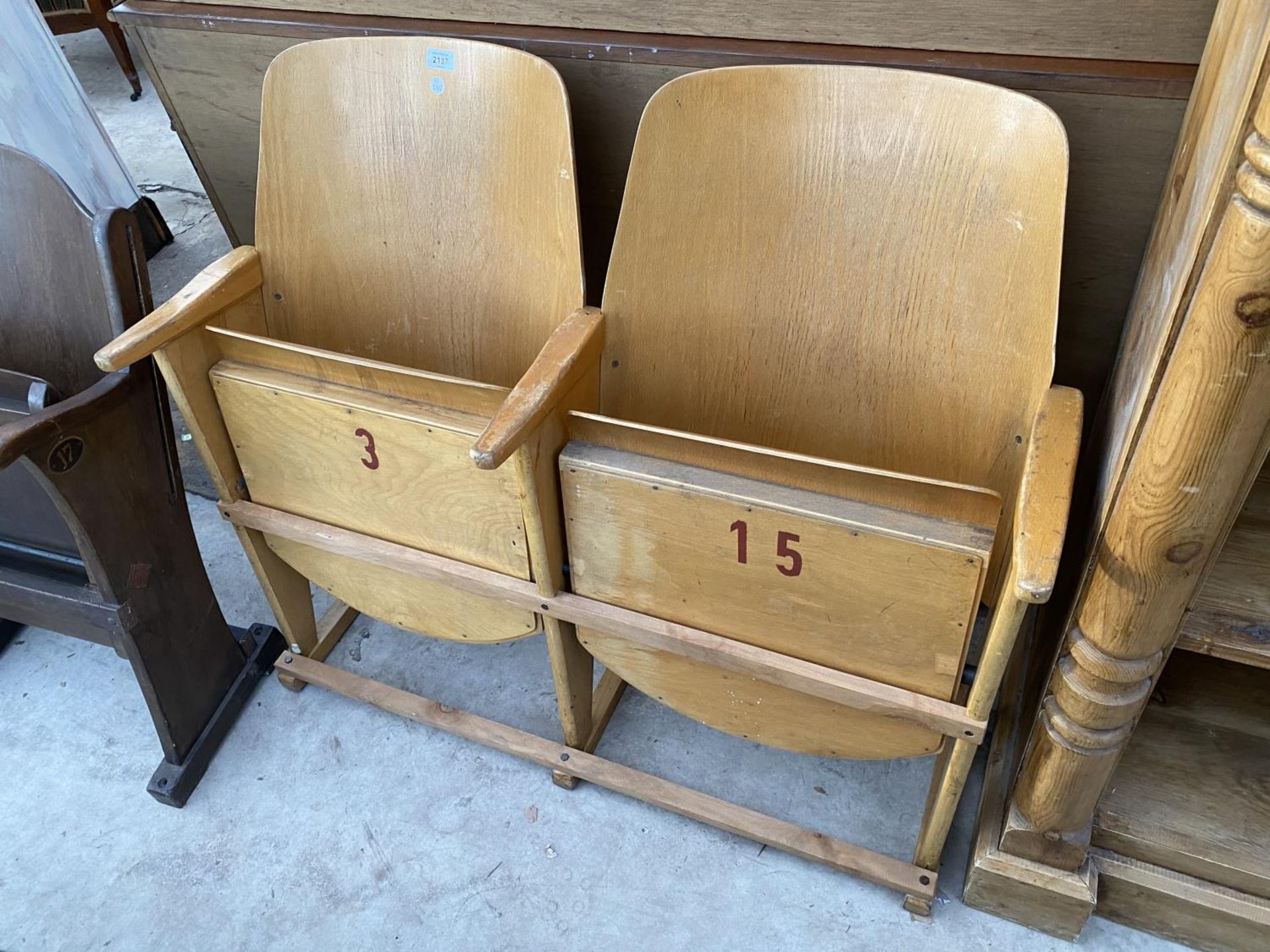 A PAIR OF BEECH THEATRE/ CINEMA SEATS WITH BENT WOOD BACKS, NUMBERED 3 AND 15