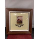 A FRAMED 'BENTLEY' PICTURE AND BADGE