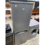 A SILVER HOTPOINT FRIDGE FREEZER BELIEVED IN WORKING ORDER BUT NO WARRANTY