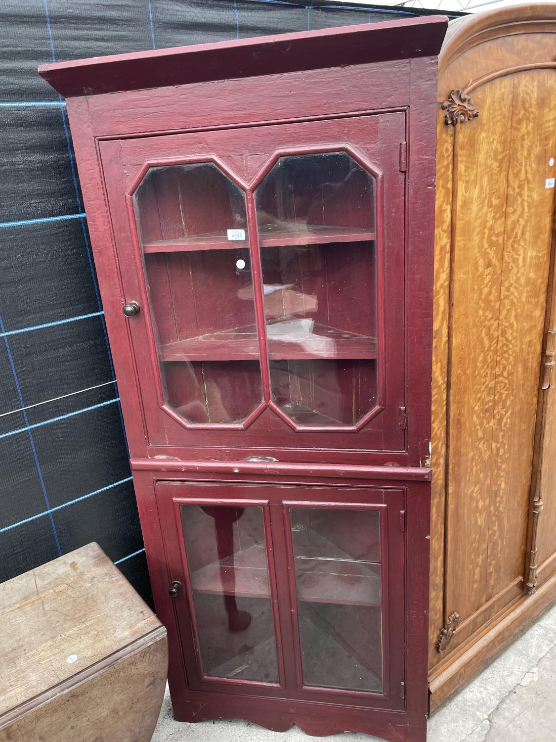 A PAINTED FULL LENGTH CORNER CUPBOARD WITH GLAZED UPPER AND LOWER DOORS