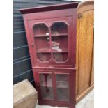 A PAINTED FULL LENGTH CORNER CUPBOARD WITH GLAZED UPPER AND LOWER DOORS