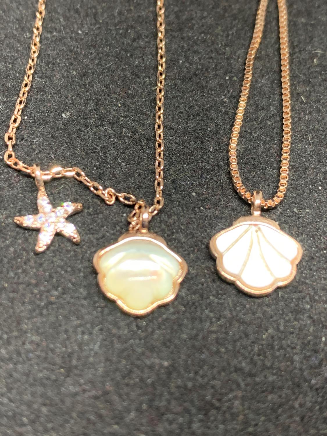 FOUR SILVER NECKLACES MARKED 925 WITH ROSE COLOURED GILDING WITH SHELL AND STAR FISH PENDANTS - Image 5 of 8