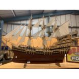 A THREE MASTED WOODEN MODEL WARSHIP L:104CM H:77CM