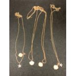 FOUR SILVER NECKLACES MARKED 925 WITH ROSE COLOURED GILDING WITH SHELL AND STAR FISH PENDANTS