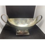 A HALLMARKED SILVER LONDON 1934 TWIN HANDLED BON BON DISH WITH WEIGHTED BASE GROSS WEIGHT