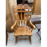 A VICTORIAN STYLE BEECHWOOD ROCKING CHAIR