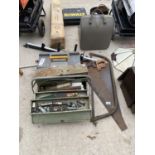 AN ASSORTMENT OF VINTAGE HAND TOOLS TO INCLUDE A BOW SAW, TWO WOOD SAWS AND A TOOL BOX ETC