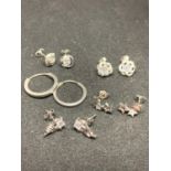 FIVE PAIRS OF SILVER EARRINGS TO INCLUDE HOOPS, STARS, FLOWERS ETC WITH CLEAR STONES
