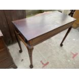 A 19TH CENTURY MAHOGANY SIDE TABLE ON BALL AND CLAW FEET, WITH SINGLE END DRAWER (POSSIBLY FORMER