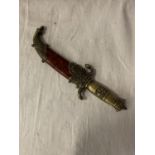 AN ORNATE SHEATHED MIDDLE EASTERN DAGGER