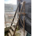 A VINTAGE FIVE RUNG WOODEN STEP LADDER