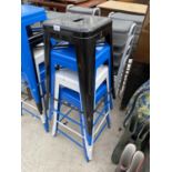 A GROUP OF FOUR METAL STACKING STOOLS