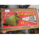 A VINTAGE 'THE STIP MASTER' 35MM FILM STRIP PROJECTOR