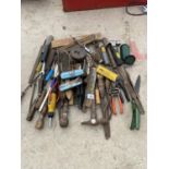 AN ASSORTMENT OF HAND TOOLS TO INCLUDE PLIERS, HAMMERS AND WIRE BRUSHES ETC