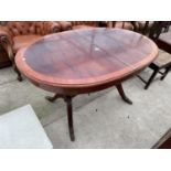 A REGENCY STYLE EXTENDING DINING TABLE