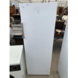 A WHITE INDESIT UPRIGHT FRIDGE BELIEVED IN WORKING ORDER BUT NO WARRANTY