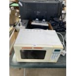 A MATSUI MICROWAVE OVEN AND THREE TOASTERS BELIEVED IN WORKING ORDER BUT NO WARRANTY