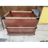 AN INDUSTRIAL VINTAGE TEXTILE TROLLEY WITH WHEELED BASE AND WOODEN BINDING
