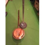 A VINTAGE SIMPLEX NO. 9 COPPER DOLLY POSSER AND A COPPER WARMING PAN WITH STAG DECORATION