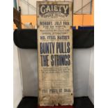 A GAIETY THEATRE AND OPERA HOUSE ADVERTISING POSTER ON BOARD FOR ' BUNTY PULLS THE STRINGS' THIS