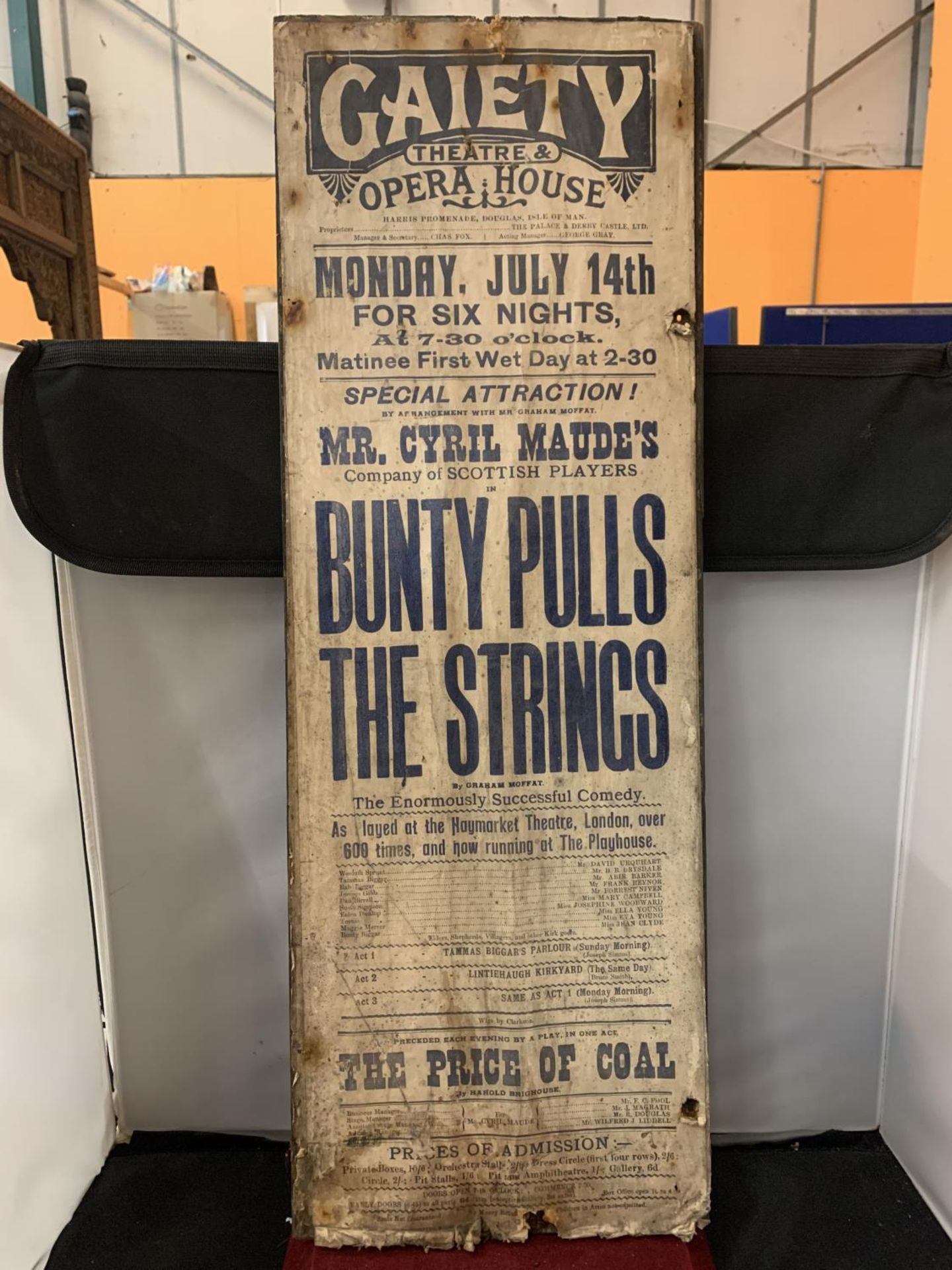 A GAIETY THEATRE AND OPERA HOUSE ADVERTISING POSTER ON BOARD FOR ' BUNTY PULLS THE STRINGS' THIS