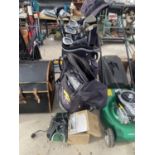 A POWA KADDY GOLF BAG WITH A QUANTITY OF CLUBS, A FURTHER GOLF BAG AND A PRACTICE PUTTER ETC