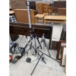 AN ASSORTMENT OF CAMERA AND LIGHTING TRIPODS