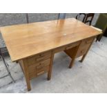 A MID 2OTH CENTURY DOUBLE PEDESTAL SIX DRAWER DESK 60" X 30"