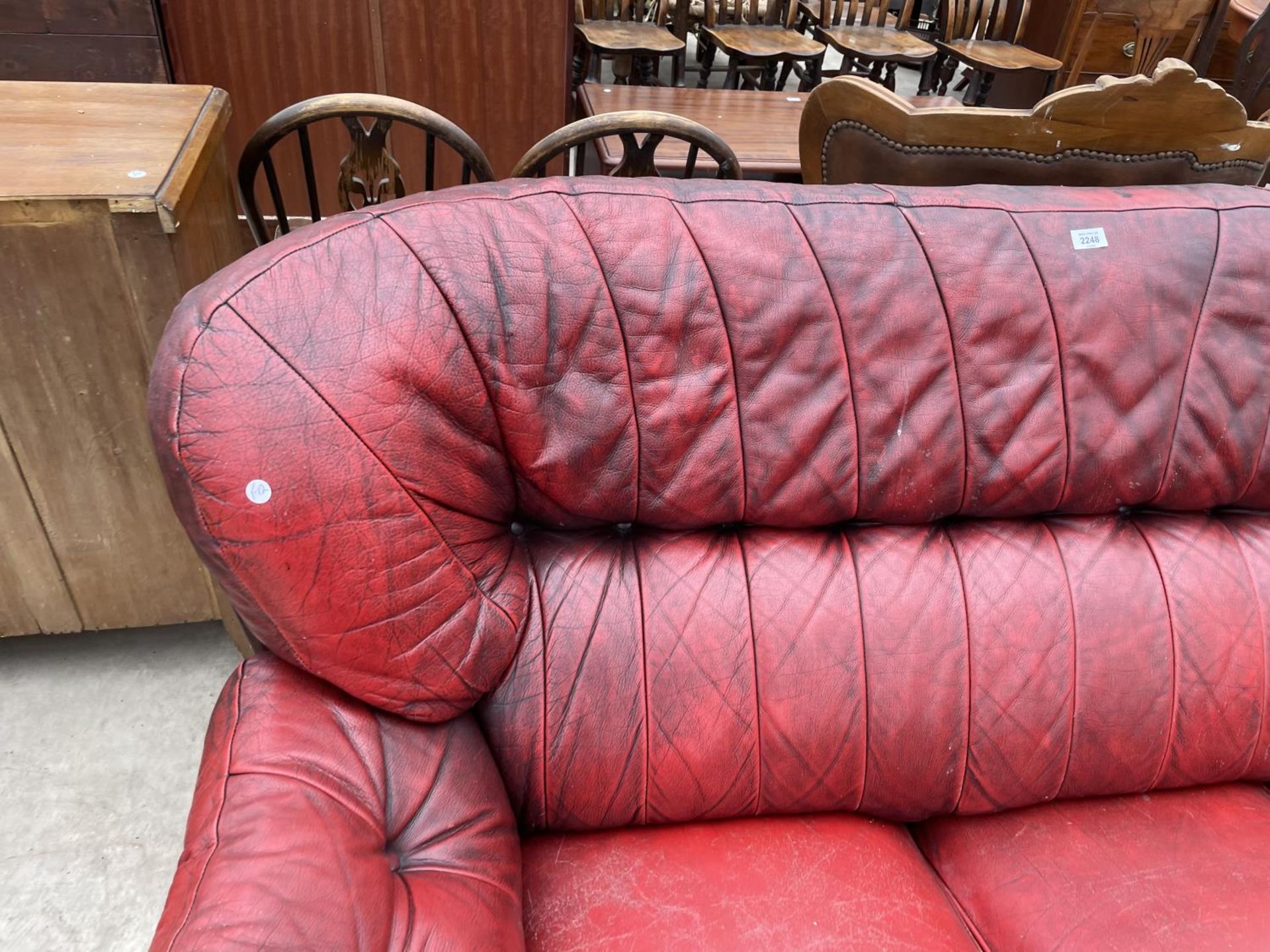 AN OXBLOOD THREE SEATER SETTEE - Image 2 of 7