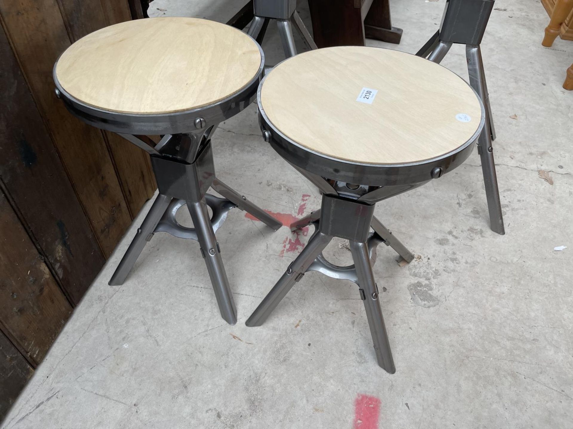 TWO LOW POLISHED METAL INDUSTRIAL STYLE STOOLS H: 18 INCHES