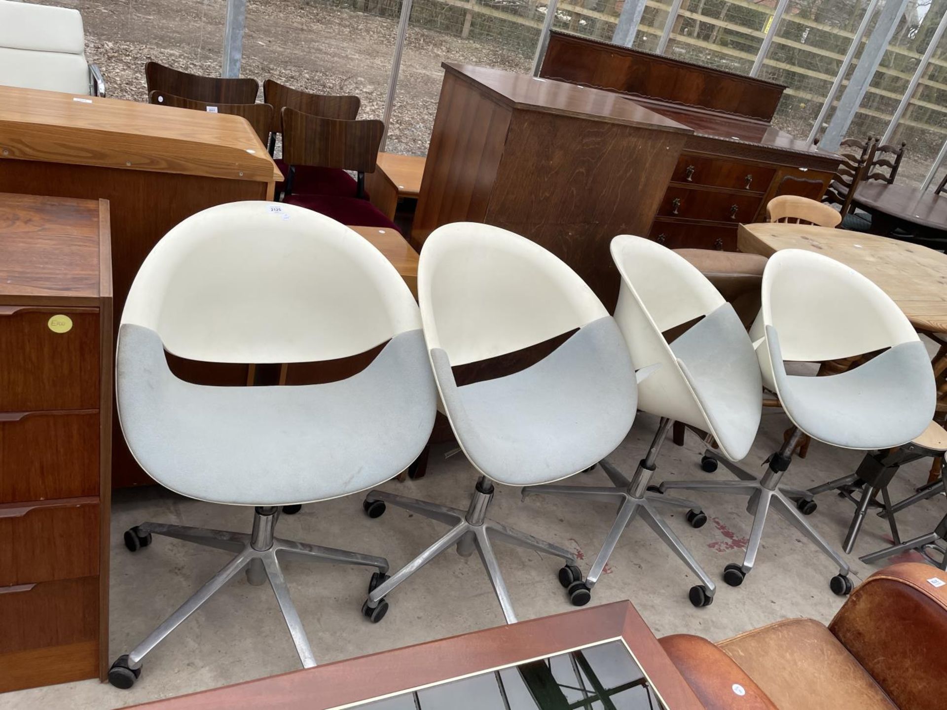 A SET OF FOUR 1970s EGG CHAIRS WITH POLYPROPOLENE SEATS ON ALLOY AND CHROME BASE