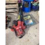 A SOVEREIGN ELECTRIC BLOWER VAC AND A TARPAULIN SHEET 2.7M X 3.6M