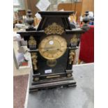 A DECORATIVE MANTEL CLOCK WITH GILT DETAILING