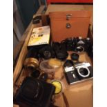 AN ASSORTMENT OF CAMERA RELATED ITEMS TO INCLUDE A ZENIT TTL AND ZENIT -E FOR REPAIR