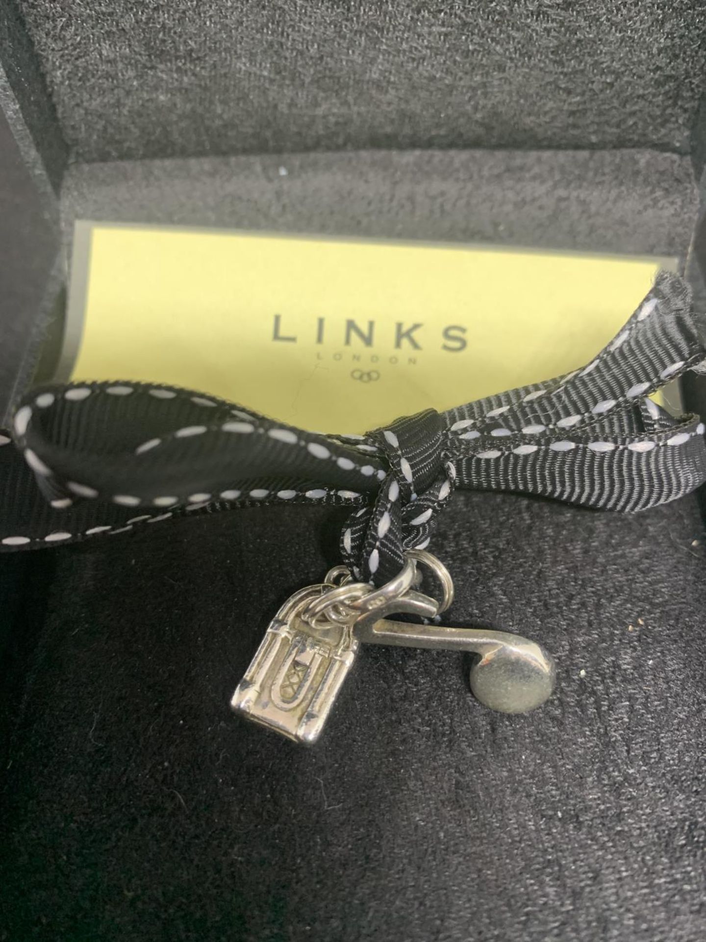 TWO LINKS OF LONDON SILVER CHARMS IN THE FORM OF A JUKE BOX AND A MUSICAL NOTE IN ORIGINAL - Image 2 of 3