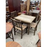 AN EARLY 20TH CENTURY FOLD-OVER DINING TABLE ON BARLEY-TWIST LEGS WITH FOUR RUSH SEATED CHAIRS 34" X